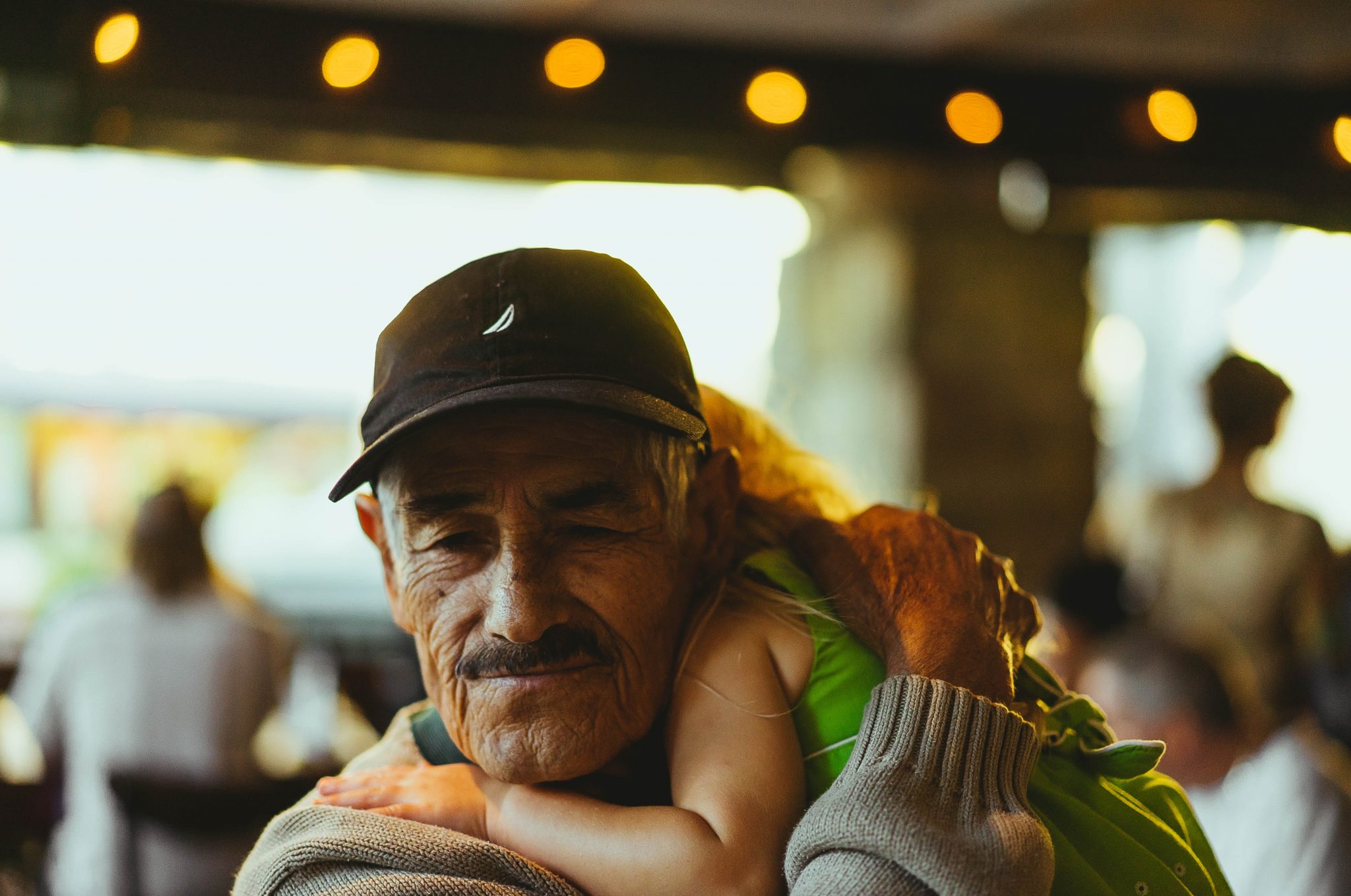 Grandparent holding grandchild