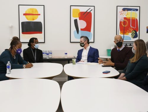 Governor Newsom and Dr. Ghaly gathered around tables meeting with stakeholders to discuss the CARE Court proposal.