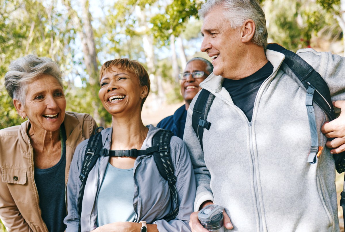 Selfie, nature and mature people hiking for fitness, health and wellness on mountain for travel. Happy, activity and senior friends with photography picture for memory on trekking trip or vacation.